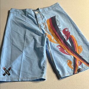 Jetting Vibrant Blue and Orange Board Shorts with Retro Flair Mens M